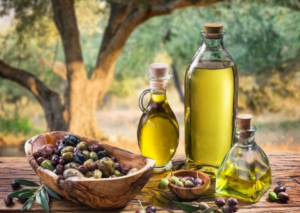 Premium extra virgin olive oil bottle with fresh olives and leaves oil vegetables seed oils cooking oils